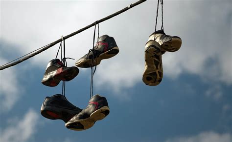 shoe tossing over power lines.